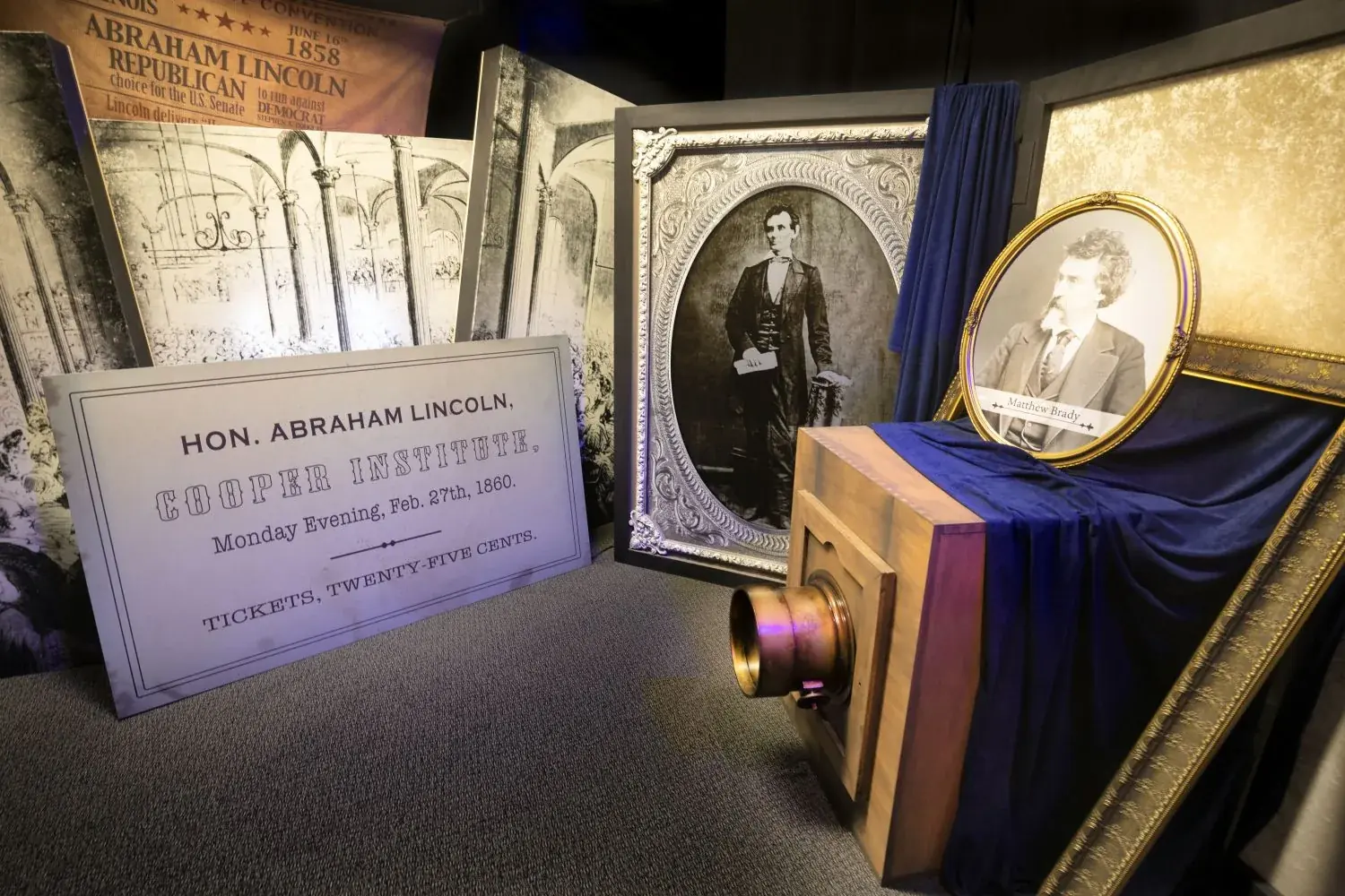A recreated room from the immersion tour showing a lectern, portraits and a period backdrop.