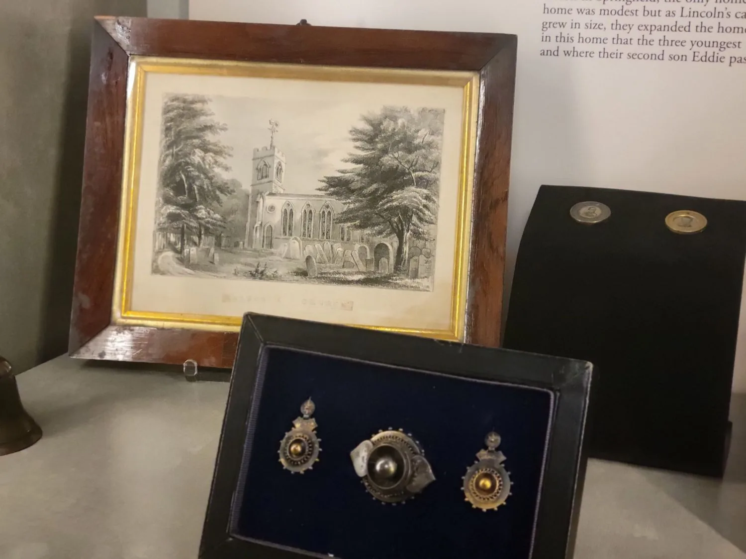 A framed print and a case of Mary Lincoln's jewelry from the special exhibit.