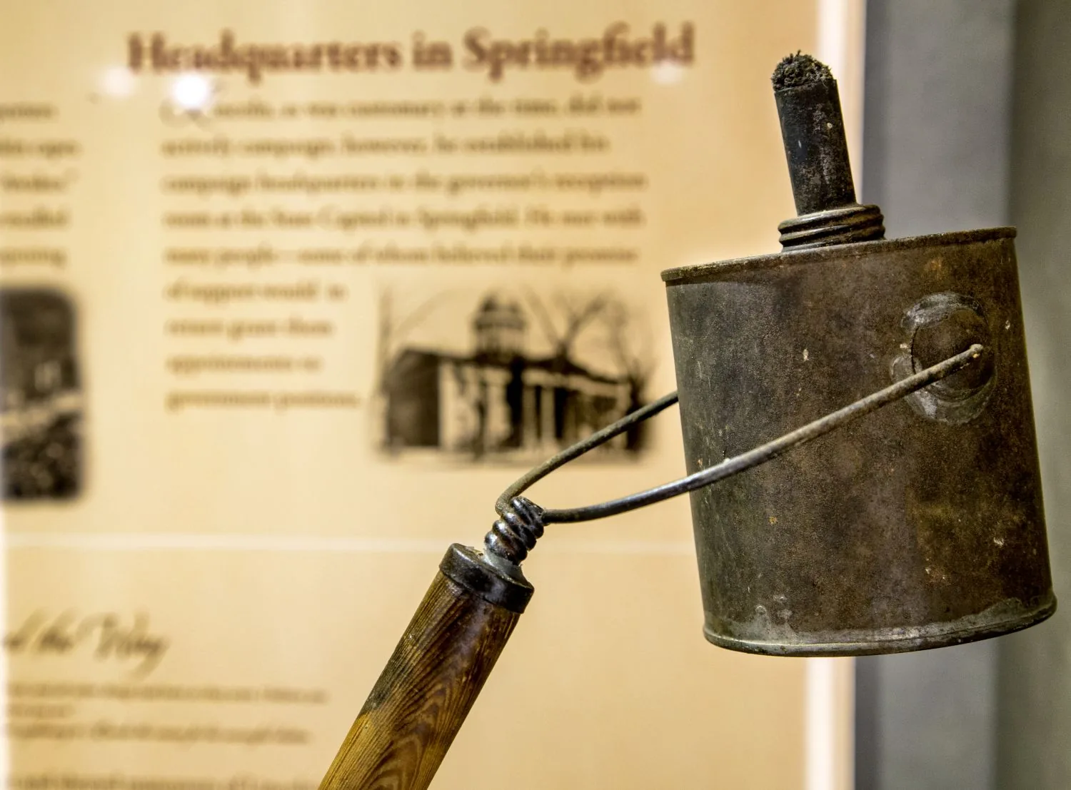 An exhibit panel titled Headquarters in Springfield beside a period artifact.